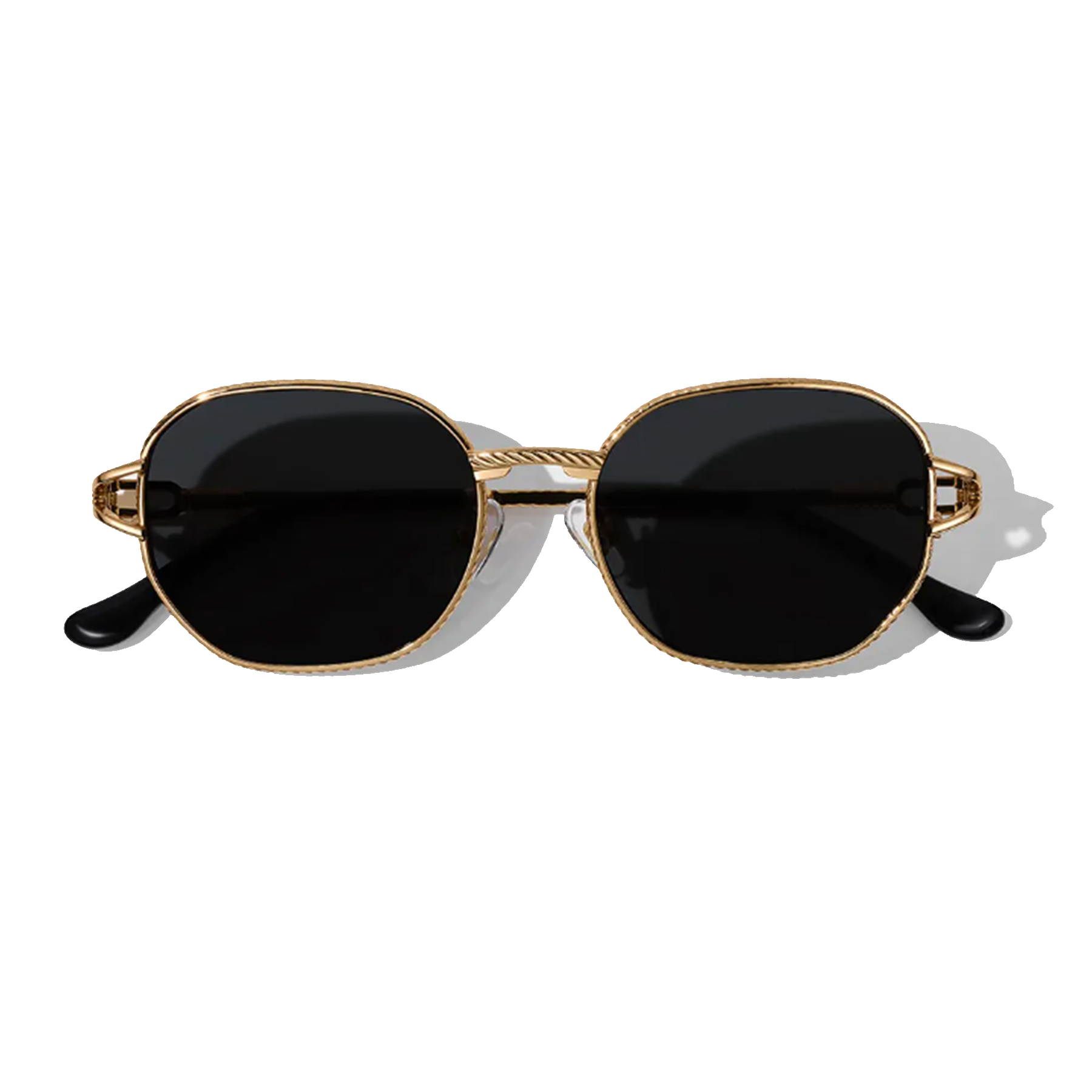 Sunglasses with gold frame and black lenses on a white background
